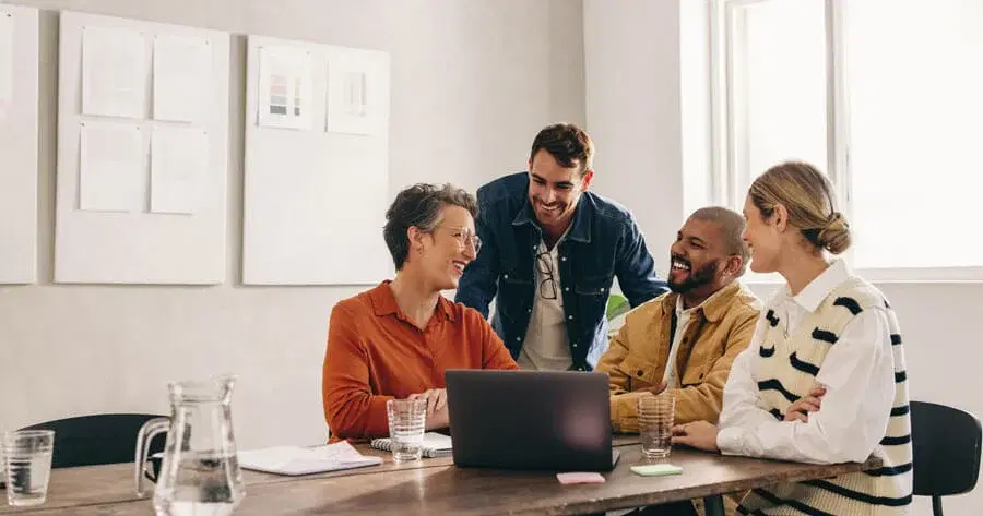 Happy team members working with headsets in a modern office